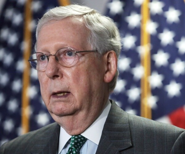 mcconnell in a gray suit and green tie