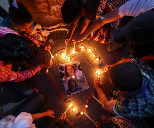 candles being lit during a vigil
