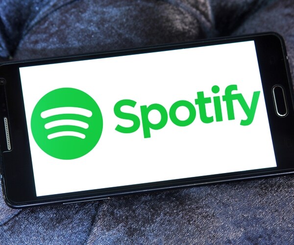 spotify corporate logo symbol emblem on computer pad screen