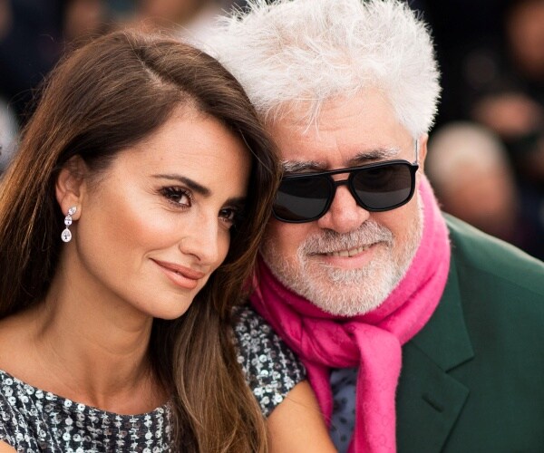 Penelope Cruz and Pedro Almodovar pose for photographers.