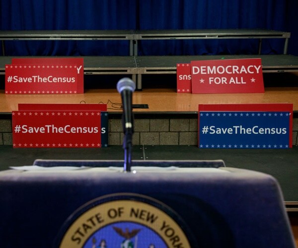 placards say save the census
