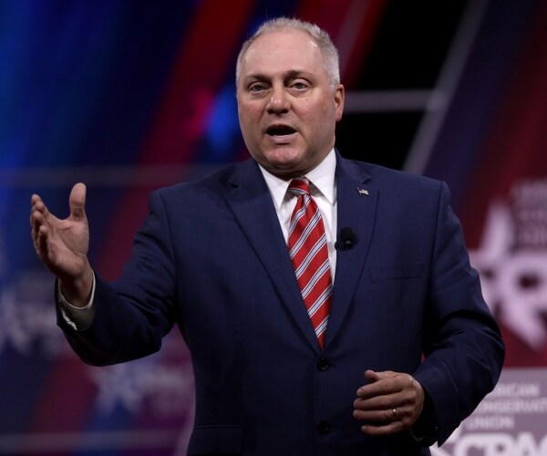 scalise in a suit and red striped tie speaking at cpac