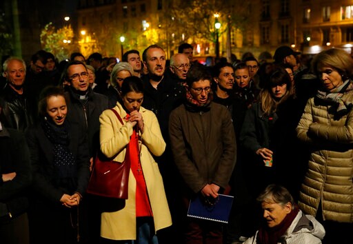 Prayers, Hymns, Community Shared in Firelight of Notre Dame