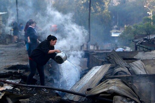 Helicopters in Chile Douse Fire That Destroyed 120 Homes