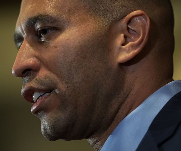 close-up headshot of rep. hakeem jeffries looking to his right