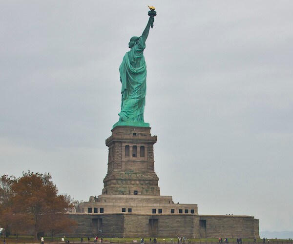 Activists Plant 'Refugees Welcome' Sign on Statue of Liberty