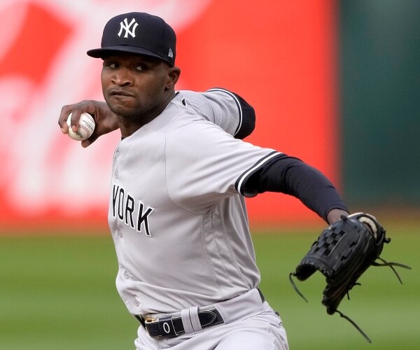domingo german throws a ball
