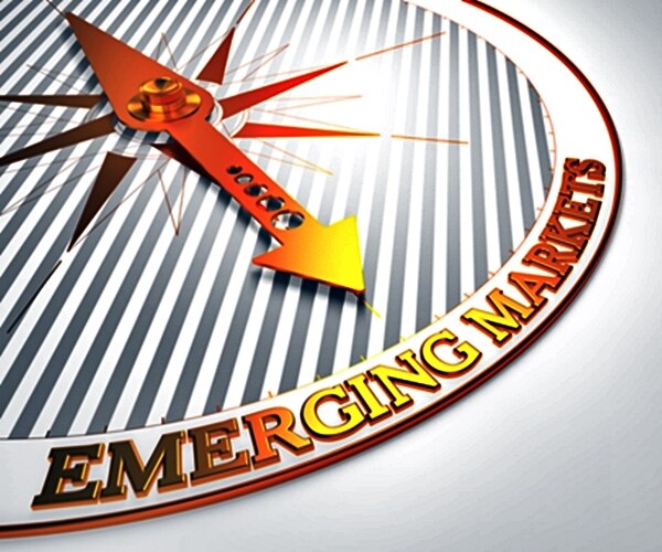 emerging markets - golden compass needle on a white field pointing

