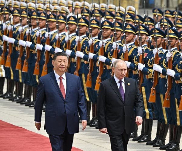 Putin, in China, Says US Sanctions Undermine Dollar