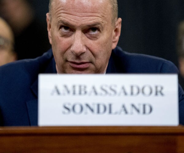 Gordon Sondland is shown giving testimony.