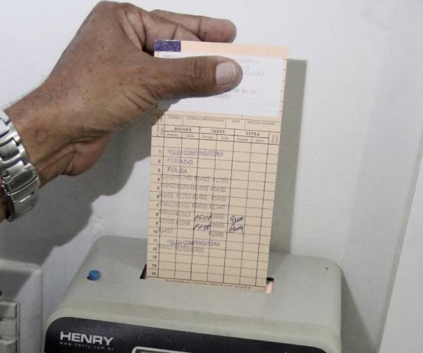 a person punching in to a time clock