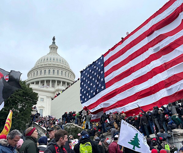 protesters storm the capitol during a large demonstration
