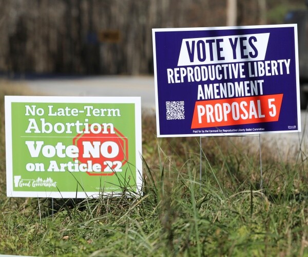 signs opposing and supporting abortions