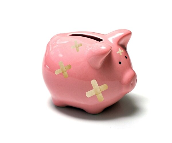 pinky piggy bank with band aid