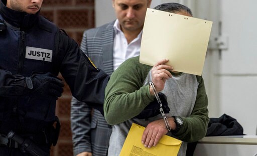 4 Men Accused of Killings in Syria Go on Trial in Germany