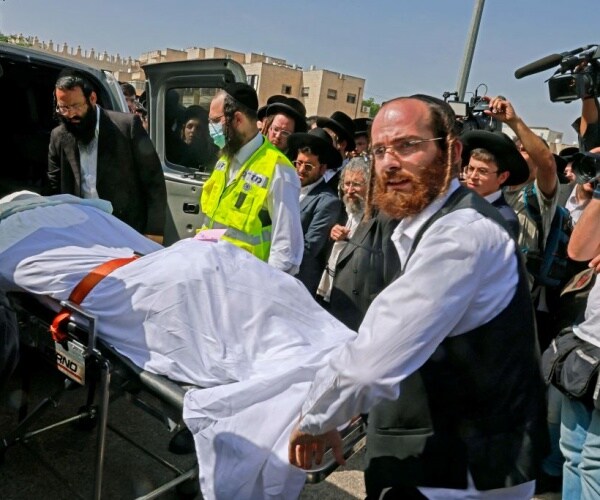 Ultra-Orthodox Jewish take part in funeral ceremony