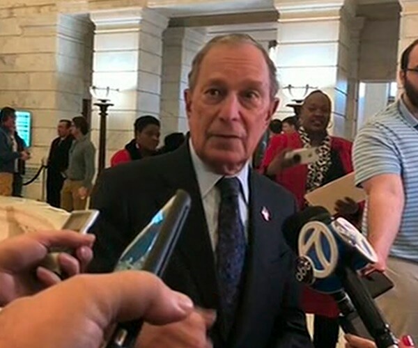 michael bloomberg speaks with reporters
