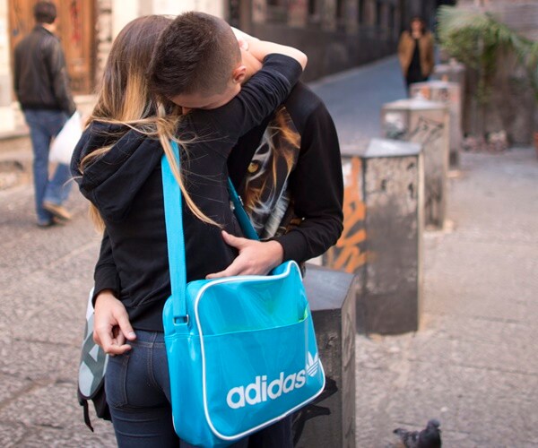a couple hugging on a street