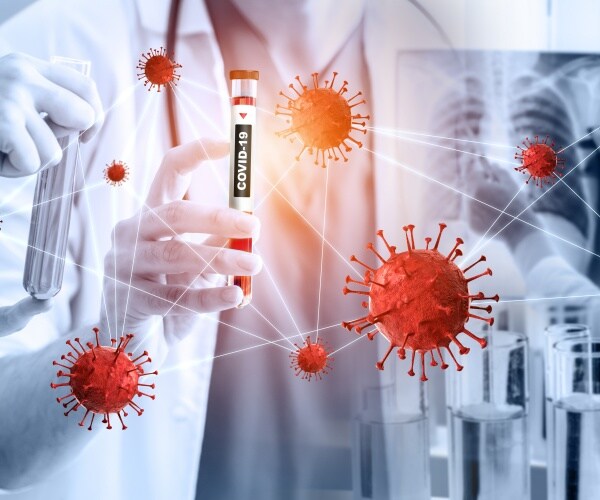 scientists examine blood samples infected with coronavirus in lab