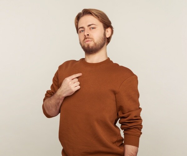 selfish man pointing to himself