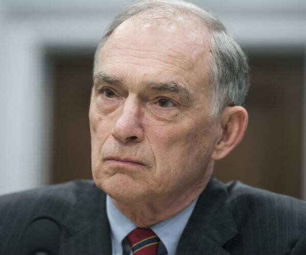 Rep. Pete Visclosky in dark suite, red striped tie and blue dress shirt on capitol hill