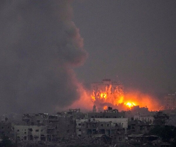 fire rises from a building