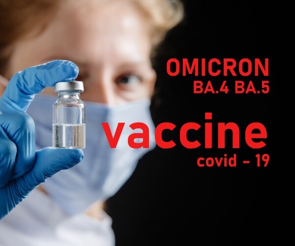 healthcare worker holding up vial of omicron BA.4, BA.5 vaccine booster