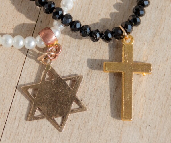  two necklaces one with the cross another star of david