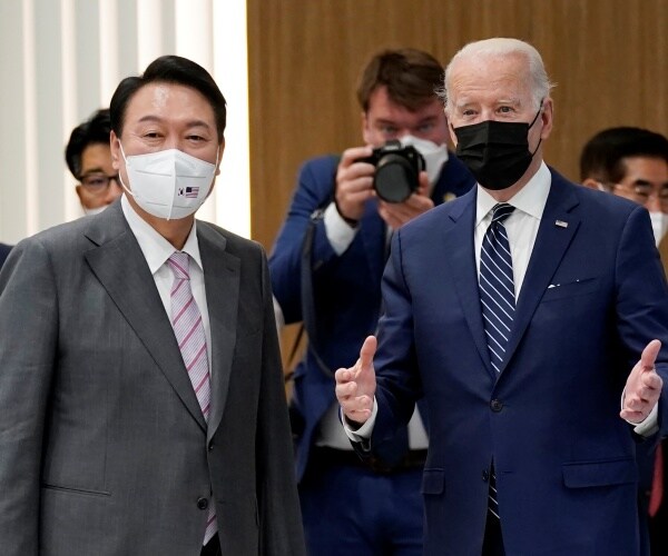 joe biden and yoon suk yeol stand side by side