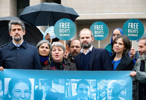 The Latest: Turkish Court Frees Activists Pending Verdicts