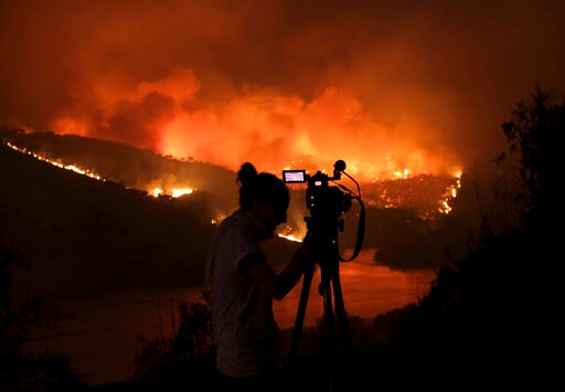 The Latest: Strong Winds, Dry Forests Fuel Portugal Fires