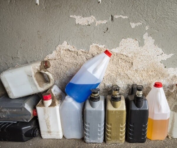 chemicals in plastic jugs in garage
