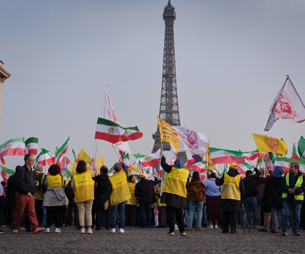 rally in an overseas nation of the west supporting the people and or citizens of a nation in the middle east 