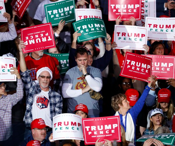 audience members at a campaign rally for president donald trump