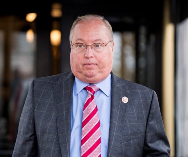 jim hagedorn walks out of building