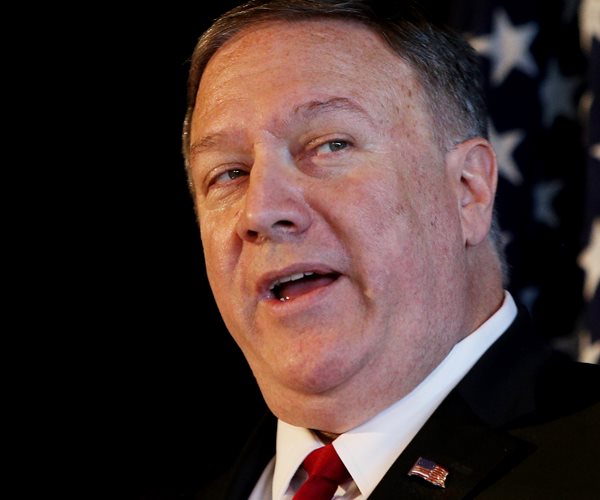 mike pompeo looks left and speaks during a news conference
