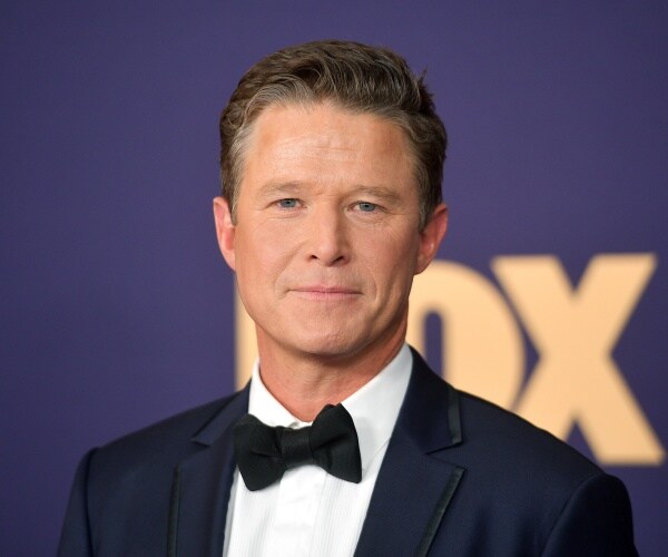 billy bush in a suit and black bow tie