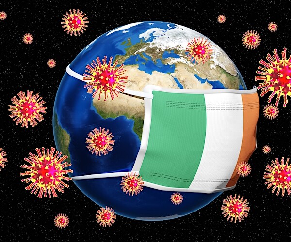 the world is wearing a facemask with coronavirus floating around in space