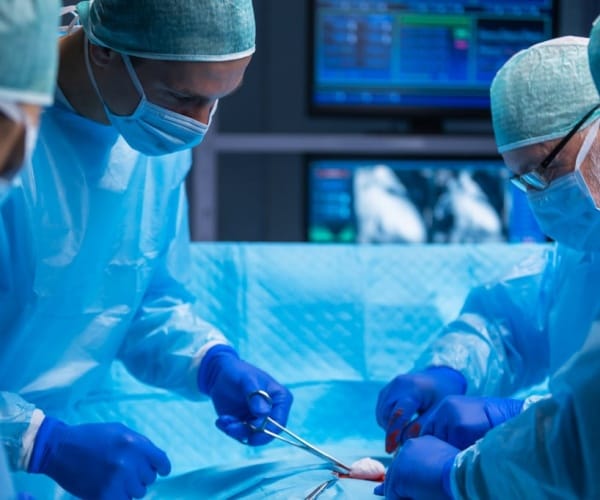 doctors performing surgery in operating room