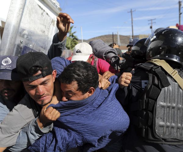 migrants clash with mexican police at the mexico-united states border