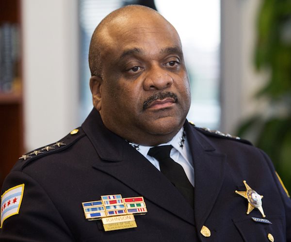 eddie johnson scowls while photographed in his police uniform