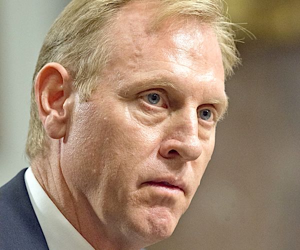 patrick shanahan listens intently during a reporter's question at a news conference