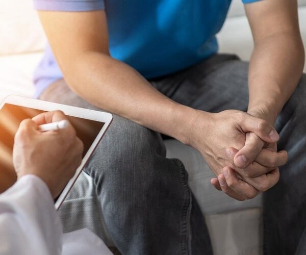 doctor talking to man about prostate cancer