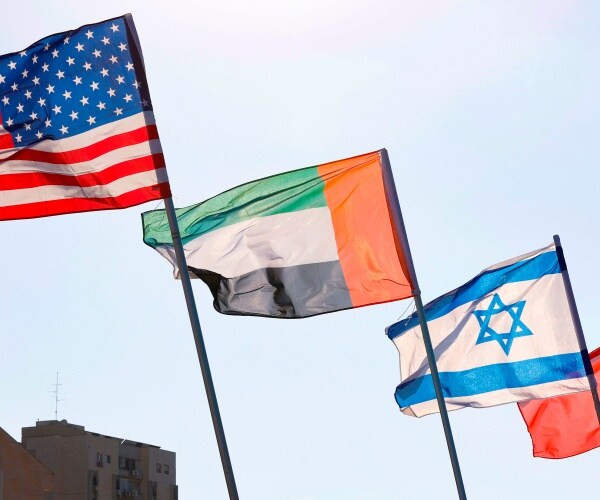 us uae israel and bahrain flags are shown flying