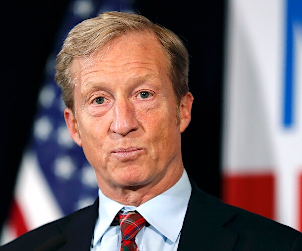 tom steyer announced his presidential candidacy at a podium with an american flag in the background