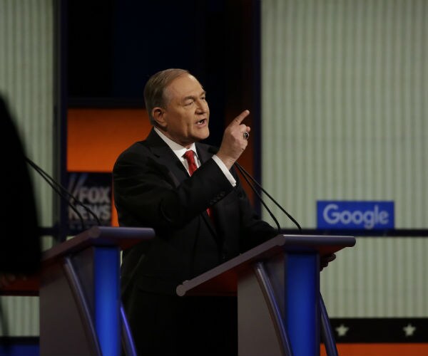 jim gilmore is shown speaking in iowa