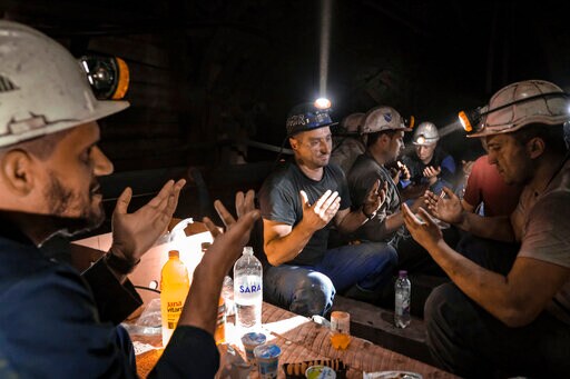 AP PHOTOS: Muslim Miners in Bosnia Break Fast Underground