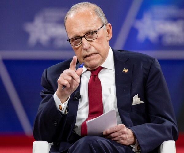 larry kudlow in a suit and red tie 