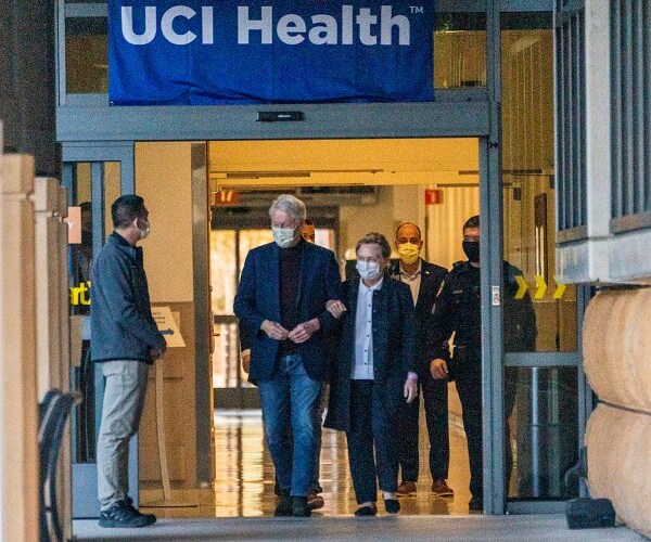 bill and hillary clinton walk out of hospital