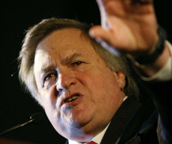 Dick Morris waves to a crowd in virginia